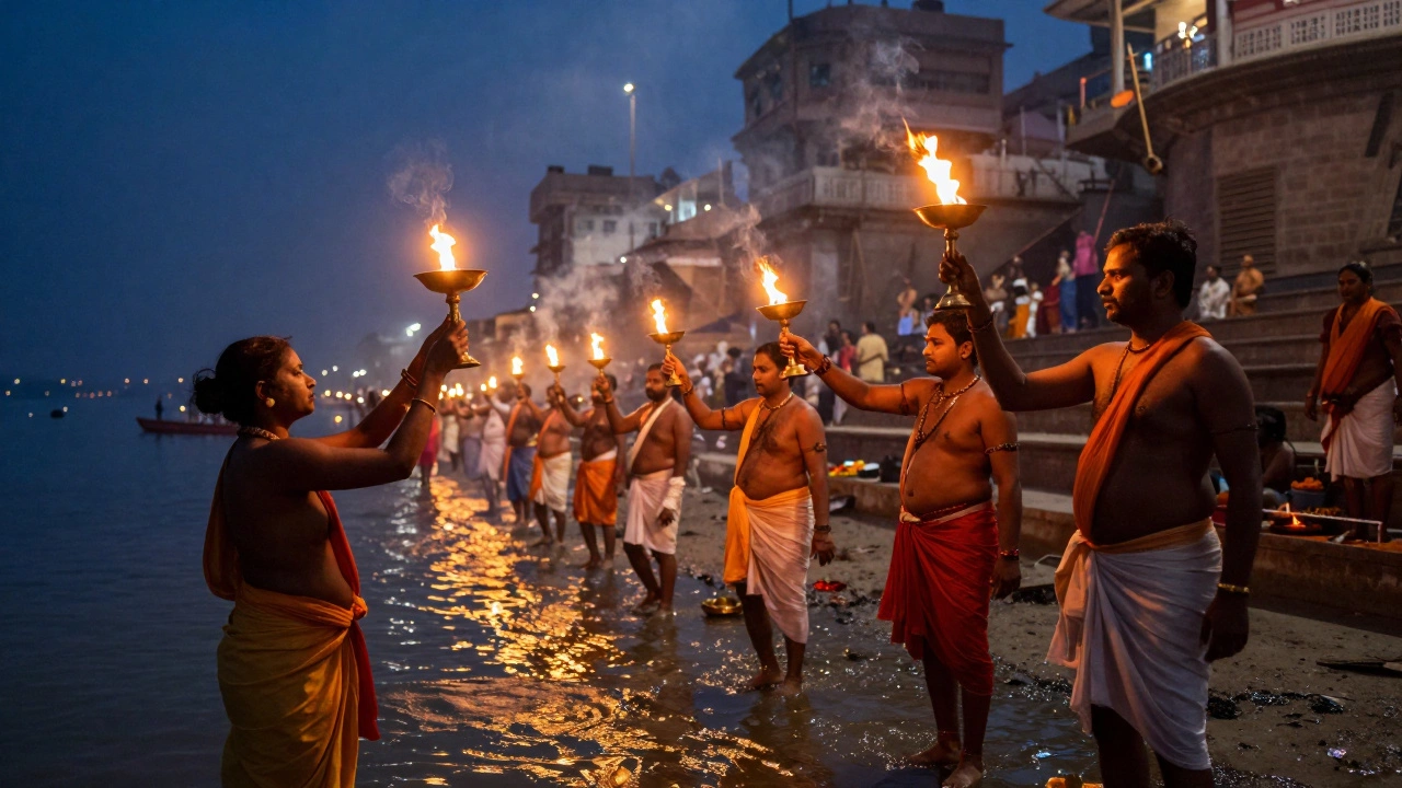 Priests performing the Ganga Aarti ceremony with fire lamps by the Ganges river